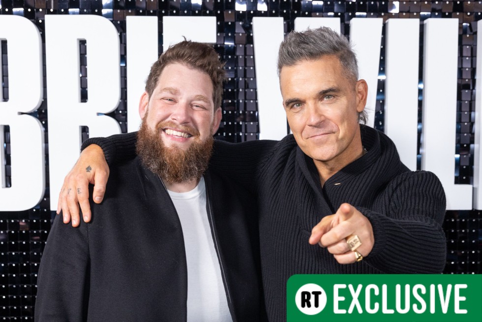 Robbie Williams and Joe Pearlman attend the launch of the Robbie Williams pop up in Covent Garde Robbie Williams and Joe Pearlman attend the launch of the Robbie Williams pop up in Covent Garden.
