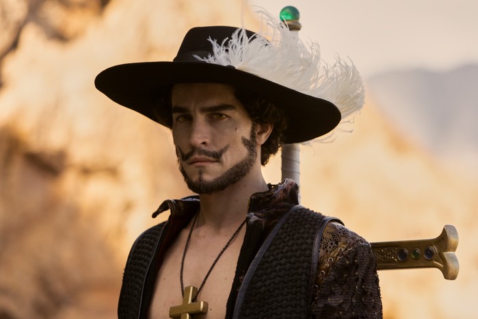 Steven Ward as Mihawk in One Piece Steven Ward as Mihawk in One Piece wearing a hat with a feather