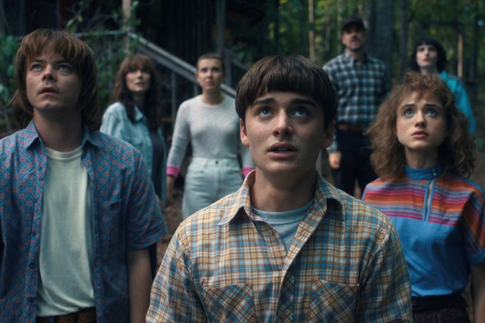 (L to R) Charlie Heaton as Jonathan Byers, Winona Ryder as Joyce Byers, Millie Bobby Brown as Eleven, Noah Schnapp as Will Byers, David Harbour as Jim Hopper, Natalia Dyer as Nancy Wheeler, and Finn Wolfhard as Mike Wheeler in Stranger Things