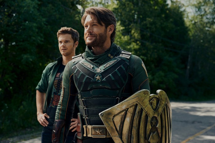 Jensen Ackles and Jack Quaid as Soldier Boy and Hughie Campbell in The Boys, standing, looking out into the distance