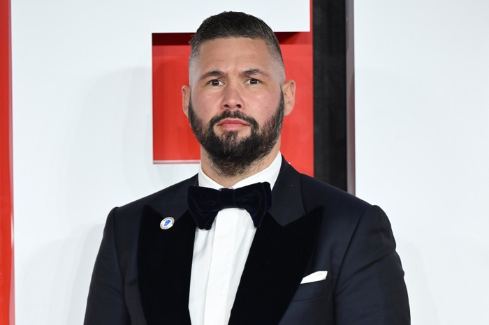 Tony-Bellew Tony Bellew wearing a suit and bow tie at the European Premiere of Creed III in London.