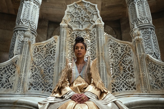 The Wheel of Time Sophie Okonedo as Siuan Sanche in The Wheel of Time wearing a gold dress, sitting in an elaborate white throne