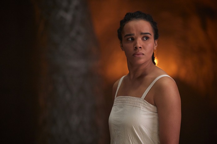 Nynaeve al'Meara played by Zoë Robins in The Wheel of Time season 2 wearing a white dress, looking concerned